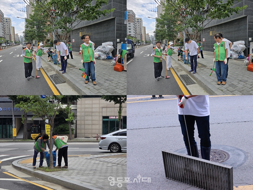 ▲영등포동 자율방재단과 동주민센터 직원이 7월 14일 오후 영등포구 국회대로 54길 일대의 빗물받이를 정비·청소하고 있다. Ⓒ영등포시대